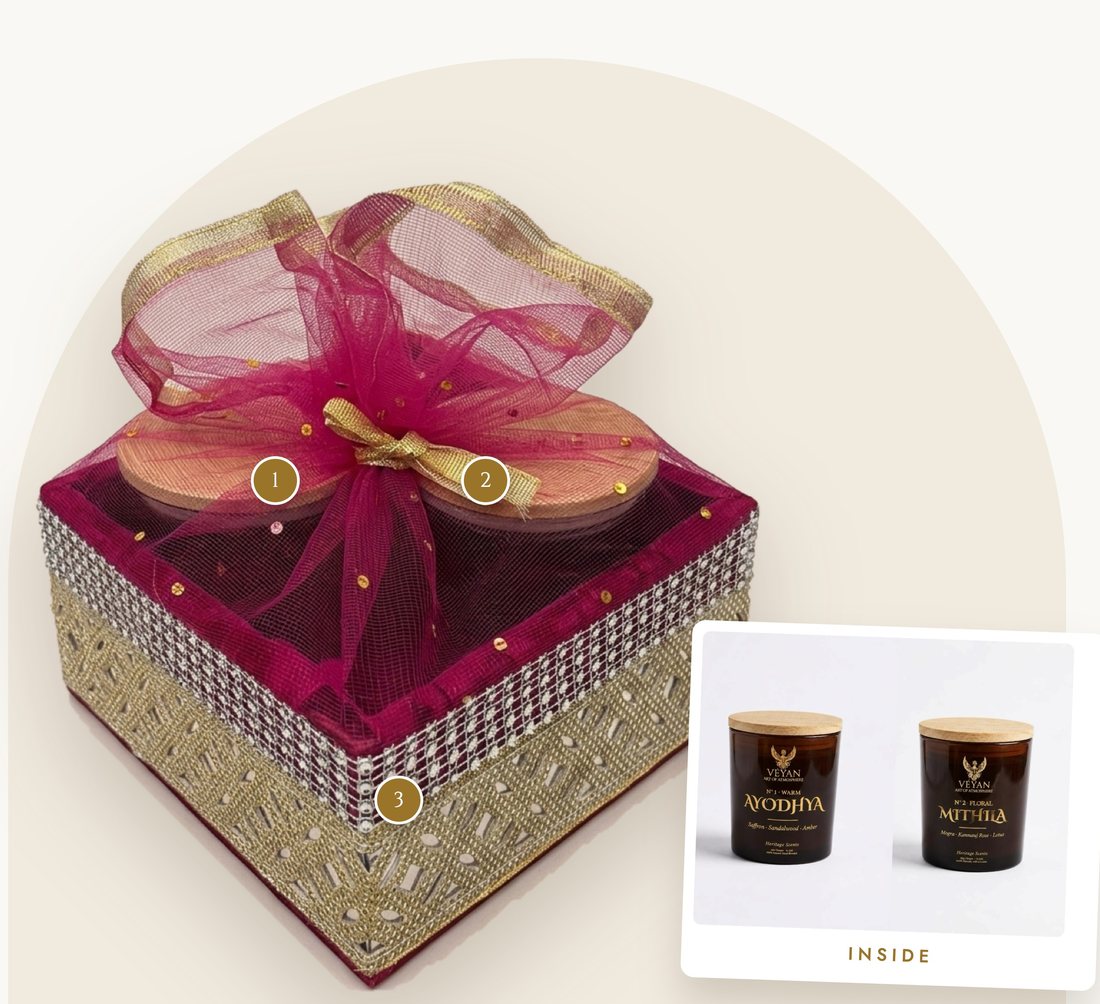 Swayamvar hamper: fuchsia and gold jewelled box tied in tulle, holding two amber glass jar candles with wooden lids