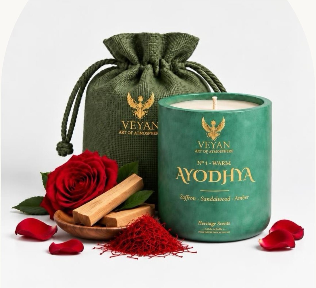 Ayodhya Heritage Scent candle in a green vessel beside its green potli, with rose, sandalwood and saffron